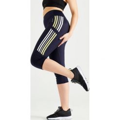 Rybaczki fitness cardio damskie 120 granatowe. Niebieskie rybaczki damskie DOMYOS, xs, bez wzorów, z elastanu. Za 49,99 zł.
