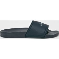 Jack & Jones - Klapki. Niebieskie kapcie męskie Jack & Jones, bez wzorów, z gumy. W wyprzedaży za 69,90 zł.