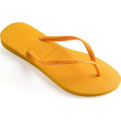 Havaianas - Japonki. Żółte klapki damskie Havaianas, bez wzorów, z materiału, bez obcasa, na obcasie. W wyprzedaży za 79,90 zł.