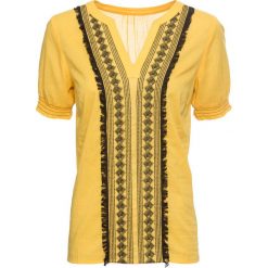 Tunika z haftem, krótki rękaw bonprix żółty szafranowy + czarny. Żółte tuniki damskie bonprix, na co dzień, z haftami, eleganckie, z dekoltem w serek, z krótkim rękawem. Za 37,99 zł.
