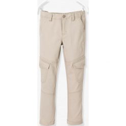 Spodnie w kolorze beżowym. Brązowe spodnie niemowlęce Vertbaudet Boys & Co., w paski. W wyprzedaży za 32,95 zł.