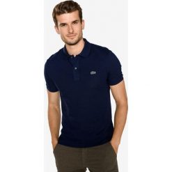 Lacoste Polo Koszulka Niebieski. Niebieskie podkoszulki męskie Lacoste, s, bez wzorów, z bawełny, polo, bez rękawów. Za 395,95 zł.