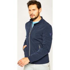 Kurtka przejściowa Guess Cummuter M02L50 WCOG0. Niebieskie kurtki męskie Guess, xl, z aplikacjami, bez kaptura. W wyprzedaży za 439,00 zł.