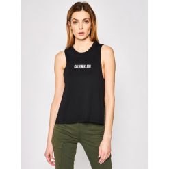 Top Calvin Klein Swimwear Beach KW0KW01009. Czarne bluzki damskie Calvin Klein Swimwear, l, bez wzorów, z bawełny, polo. Za 179,00 zł.