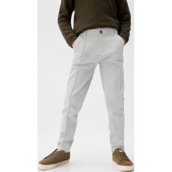 Mango Kids - Spodnie dziecięce Jet 110-164 cm. Szare spodnie chłopięce Mango Kids, bez wzorów, z bawełny. W wyprzedaży za 49,90 zł.