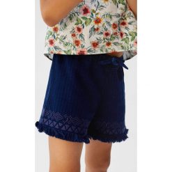 Mango Kids - Szorty dziecięce Trop 110-164 cm. Niebieskie spodenki dziewczęce Mango Kids, z haftami, z bawełny, casualowe. W wyprzedaży za 49,90 zł.