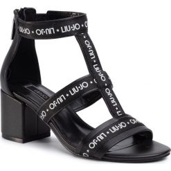 Sandały LIU JO - Thelma 06 SA0117 P0062 Nero 22222. Czarne klapki damskie Liu Jo, bez wzorów, ze skóry ekologicznej, bez obcasa, na obcasie. Za 599,00 zł.