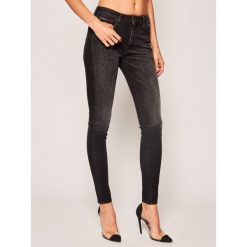 Jeansy Super Skinny Fit Tommy Jeans Sylvia DW0DW08168. Czarne jeansy damskie Tommy Jeans, bez wzorów, z jeansu. W wyprzedaży za 329,00 zł.