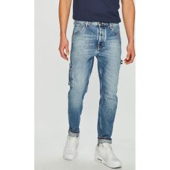 Tommy Jeans - Jeansy Tapered Carpenter. Niebieskie jeansy męskie marki Tommy Jeans. Za 539,90 zł.