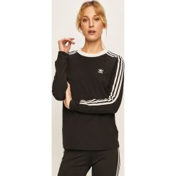 Adidas Originals - Longsleeve. Czarne t-shirty damskie adidas Originals, bez wzorów, z elastanu, casualowe, z okrągłym kołnierzem. W wyprzedaży za 129,90 zł.