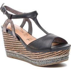 Espadryle TAMARIS - 1-28371-22 Black Leather 003. Czarne espadryle damskie marki Tamaris, bez wzorów, ze skóry ekologicznej, bez obcasa, na obcasie. Za 239,90 zł.