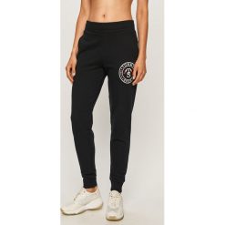 Tommy Sport - Spodnie. Niebieskie spodnie damskie Tommy Sport, s, bez wzorów, z bawełny. Za 379,90 zł.
