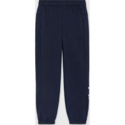 Adidas - Spodnie dziecięce 140 - 176 cm. Niebieskie dresy chłopięce Adidas, z bawełny. W wyprzedaży za 89,90 zł.