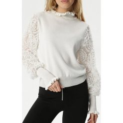 Biały Golf Costa. Białe swetry damskie Born2be, s, bez wzorów, z tkaniny, eleganckie, bez rękawów, bez kaptura. Za 119,99 zł.
