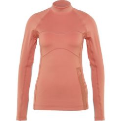 Adidas by Stella McCartney TRAIN Bluzka z długim rękawem raw pink. Różowe bluzki sportowe damskie marki adidas by Stella McCartney, xs, z elastanu, z długim rękawem. Za 379,00 zł.