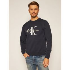 Bluza Calvin Klein Jeans Monogram Logo J30J314313. Niebieskie bluzy męskie Calvin Klein Jeans, xs, bez wzorów, z jeansu, bez kołnierzyka, bez rękawów, bez kaptura. Za 399,00 zł.