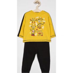 Blukids - Dres dziecięcy 68-98 cm. Żółte spodnie chłopięce Blukids, z nadrukiem, z bawełny, długie. W wyprzedaży za 37,90 zł.