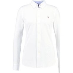 Polo Ralph Lauren HEIDI Koszula white. Szare koszulki polo damskie marki U.S. Polo, s, z bawełny, casualowe, z klasycznym kołnierzykiem, z długim rękawem. Za 519,00 zł.