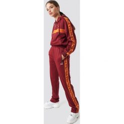 FILA Spodnie Thora Track - Red. Czerwone spodnie z wysokim stanem Fila, w paski. Za 283,95 zł.