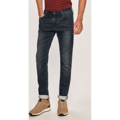 Armani Exchange - Jeansy J14. Niebieskie jeansy męskie Armani Exchange, z aplikacjami. Za 479,90 zł.