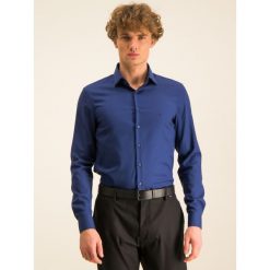 Koszula Calvin Klein K10K104975. Niebieskie koszule męskie Calvin Klein, m, bez wzorów, z bawełny, biznesowe, bez kołnierzyka, bez rękawów. W wyprzedaży za 219,00 zł.