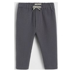 Mango Kids - Spodnie dziecięce Gofre 62-80 cm. Szare spodnie chłopięce Mango Kids, bez wzorów, z bawełny, casualowe. Za 69,90 zł.