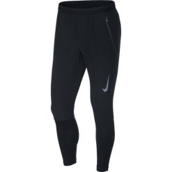 Spodnie Nike Swift Trousers M Czarne. Czarne spodnie męskie Nike, na imprezę, s, bez wzorów, z materiału. Za 239,99 zł.