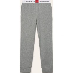 Calvin Klein Underwear - Spodnie piżamowe dziecięce 128-176 cm. Szare piżamy chłopięce Calvin Klein Underwear, bez wzorów, z bawełny. Za 229,90 zł.