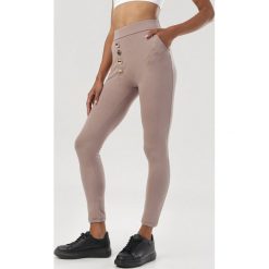 Beżowe Legginsy Urileli. Brązowe legginsy damskie Born2be, s, bez wzorów. Za 69,99 zł.