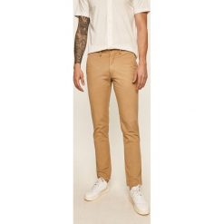 Polo Ralph Lauren - Spodnie. Brązowe spodnie męskie Polo Ralph Lauren, na co dzień, bez wzorów, z elastanu. W wyprzedaży za 449,90 zł.