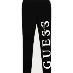 Guess Jeans - Legginsy dziecięce 116-176 cm. Czarne spodnie dziewczęce Guess Jeans, z nadrukiem, z elastanu. Za 159,90 zł.