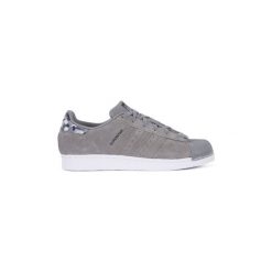 Buty adidas STAN SMITH J. Białe trampki i tenisówki damskie marki Adidas, bez wzorów, bez zapięcia. Za 333,99 zł.