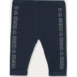 Guess Jeans - Legginsy dziecięce 92-122 cm. Niebieskie spodnie dziewczęce Guess Jeans, z aplikacjami, z elastanu. Za 99,90 zł.