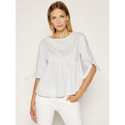 Bluzka Tommy Jeans Tjw Sleeve Bow Detal DW0DW07934. Niebieskie bluzki damskie Tommy Jeans, s, bez wzorów, z jeansu, bez kołnierzyka, bez rękawów. W wyprzedaży za 249,00 zł.