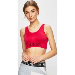 Guess Jeans - Biustonosz sportowy. Czarne biustonosze sportowe damskie Guess Jeans, s, z nadrukiem, z elastanu. W wyprzedaży za 99,90 zł.