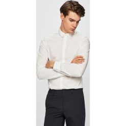 Armani Exchange - Koszula. Białe koszule męskie Armani Exchange, xl, bez wzorów, z elastanu, klasyczne, z klasycznym kołnierzykiem, z długim rękawem. W wyprzedaży za 229,90 zł.