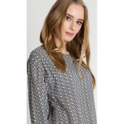 Czarno-biała bluza z długim rękawem BIALCON. Czarne bluzy sportowe damskie BIALCON, bez wzorów, z jeansu, z długim rękawem, długie, bez kaptura. W wyprzedaży za 116,00 zł.