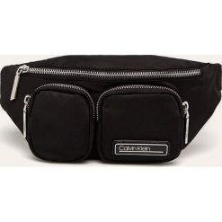 Calvin Klein - Nerka. Różowe nerki damskie Calvin Klein, w paski, z poliesteru, małe, z aplikacjami. Za 299,90 zł.