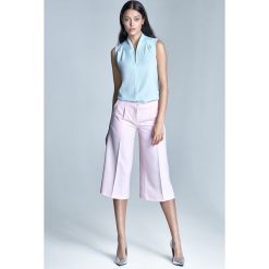 Jasnoróżowe spodnie culottes. Spodnie damskie NIFE, xl, z elastanu. Za 149,00 zł.