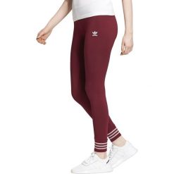 Adidas Originals Legginsy Czerwony. Czerwone spodnie damskie adidas Originals, s, bez wzorów, z elastanu. Za 145,95 zł.