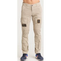 SPODNIE ANTI-G Aeronautica Militare. Brązowe spodnie męskie Aeronautica Militare, na imprezę, m, z aplikacjami, z elastanu. Za 989,00 zł.