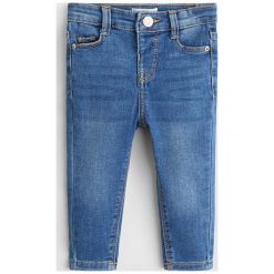 Mango Kids - Jeansy dziecięce 80 - 104 cm. Niebieskie jeansy dziewczęce Mango Kids, bez wzorów, z elastanu. Za 59,90 zł.