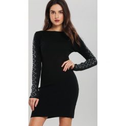 Czarna Sukienka Kearns. Czarne sukienki damskie Renee, xl, bez wzorów, z dzianiny, eleganckie, bez kołnierzyka, z długim rękawem, długie, mini, dopasowane. Za 89,99 zł.