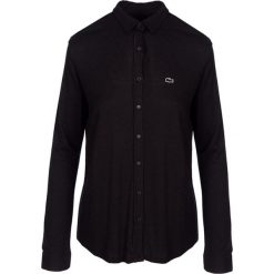 Koszulka polo w kolorze czarnym. Czarne koszulki damskie marki Lacoste, bez wzorów, polo, bez rękawów. W wyprzedaży za 299,95 zł.
