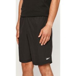 Reebok - Szorty. Czarne spodenki i szorty męskie Reebok, s, bez wzorów, z tkaniny, casualowe. Za 99,90 zł.