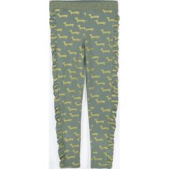 Coccodrillo - Legginsy dziecięce 128-146 cm. Żółte spodnie dziewczęce COCCODRILLO, bez wzorów, z dzianiny. Za 55,90 zł.