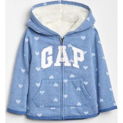 Bluza w kolorze jasnoniebieskim. Niebieskie bluzy niemowlęce Gap Kids, z aplikacjami, bez rękawów, bez kaptura. W wyprzedaży za 79,95 zł.
