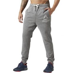 SPODNIE EL PRIME GROUP PANT BK5052. Szare spodnie męskie marki Reebok, m, bez wzorów. Za 129,00 zł.