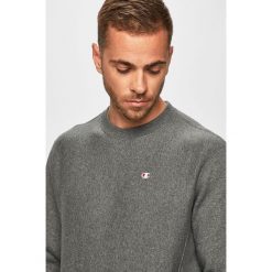 Champion - Bluza. Niebieskie bluzy męskie Champion, m, z nadrukiem, z bawełny, z okrągłym kołnierzem, bez rękawów, bez kaptura. W wyprzedaży za 219,90 zł.