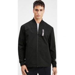 Puma Nu-Tility Kurtka Czarny. Czarne płaszcze męskie Puma, na wiosnę, s, bez wzorów, z elastanu, bez kaptura. Za 343,95 zł.